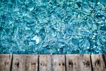 Sparkling blue water below deck