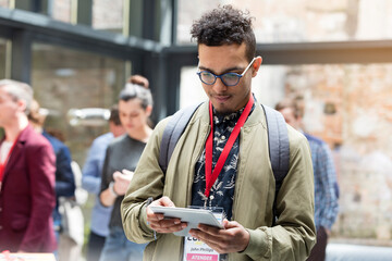 Man using digital tablet at technology conference