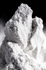 Kaolin on isolated black background, is an inorganic mineral, chemically inert, used in several branches of industry, from cosmetics to dye