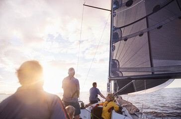 Friends sailing on sunny ocean