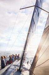 Friends sailing on sunny ocean