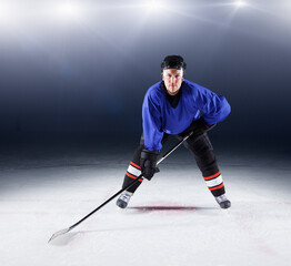 Portrait confident hockey player on ice