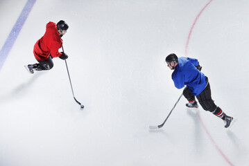 Obraz premium Overhead view hockey opponents with puck