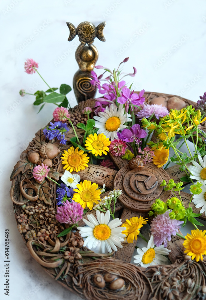 Wall mural altar for summer solstice, litha wiccan holiday. wheel of the year with colorful flowers and triple 