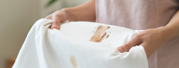 dirty food mark on clothes, Close-up food stain dirt on the shirt prepare cleaning mark removal before laundry.