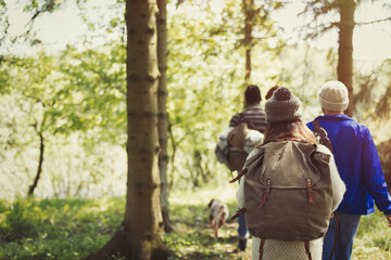 Fototapeta na wymiar Friends backpacking hiking in woods