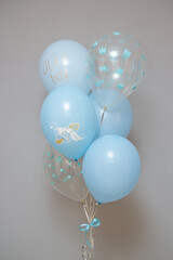 set of blue balloons on a gray background