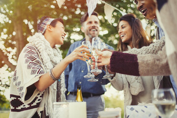 Friends toasting champagne glasses at birthday party