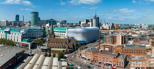 View of the skyline of Birmingham, UK including The church of St Martin, the Bullring shopping centre and the outdoor market. - obrazy, fototapety, plakaty
