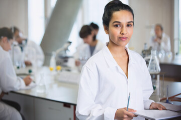 Portrait serious female college student in science laboratory classroom