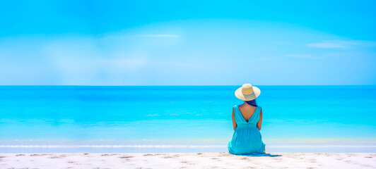 An attractive woman sitting on a white beach. AI generative