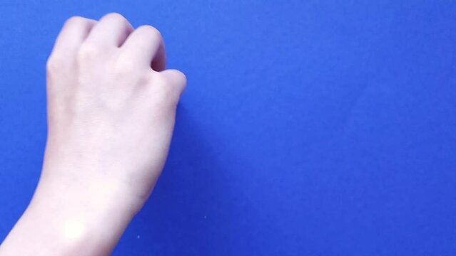 Hand writing from wooden cubes block word do it on a blue background.