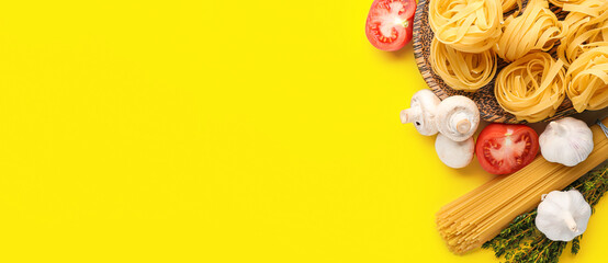 Different types of pasta, mushrooms, garlic and tomatoes on yellow background with space for text