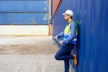 Portrait of foreman or worker working holding clipboard at Container cargo site checkup goods in container. import export shipping business concept.