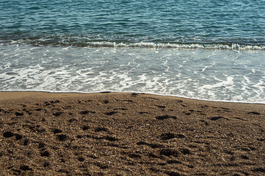 Sea waves on a sand beach