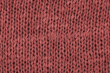 red unusual texture.knitted red sweater close up. handmade concept