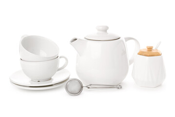Teapot, cups, sugar bowl and tea infuser isolated on white background
