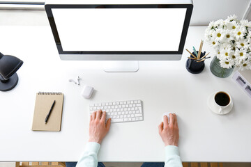 Man working with computer at table in office, closeup