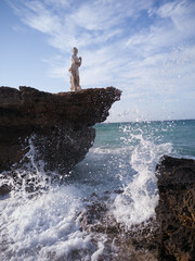 statue on the rocks