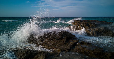 waves crashing on rocks