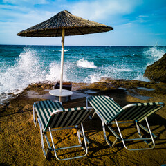 beach with umbrellas and chairs