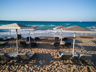 beach with umbrellas and chairs