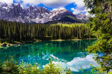 Foto op Canvas Idyllic nature scenery- turquoise mountain lake Carezza surrounded by Dolomites rocks- one of the most beautiful lakes of Alps. South Tyrol region. Italy © Freesurf