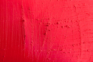 Coral color scratched wall as background