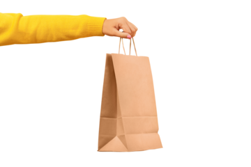 Woman hand holding paper shopping bag isolated on transparent background. Discounts and sale of concept.