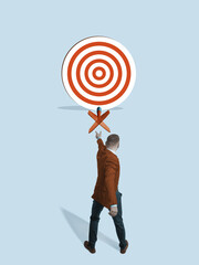 A businessman throws a dart at a target.  Art collage.
