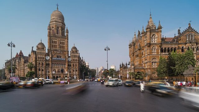 Timelapse view of traffic in front of historic landmarks BMC Building and Chhatrapati Shivaji Terminus aka Victoria Station in South Mumbai, Maharashtra, India.
