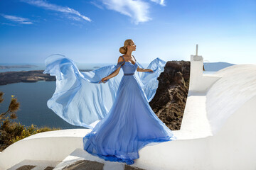 Elegant luxury evening fashion. Glamour, stylish elegant woman in long gown dress is posing outdoor...