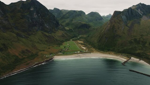 Long panoramic aerial shot of vast tranquill Ersfjord Beach on Senja Island in Norway