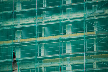 Wall of green scaffolding.