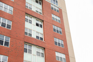 Brick buildings: icons of stability, progress, and community. Offices and apartment complexes symbolize growth, urban living, and shared aspirations