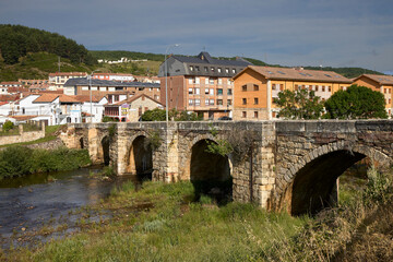 Cervera de Pisuerga (Spain), June 13, 2023. Bridge over the Pisuerga river. This is a small town in the province of Palencia, belonging to the Community of Castilla y León.