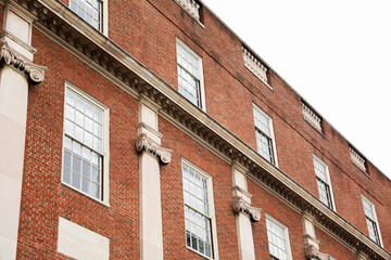 Brick buildings: icons of stability, progress, and community. Offices and apartment complexes symbolize growth, urban living, and shared aspirations
