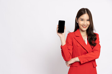Naklejka premium Portrait of Asian business woman in red showing or presenting mobile phone application isolated over white background, Asia Thai model
