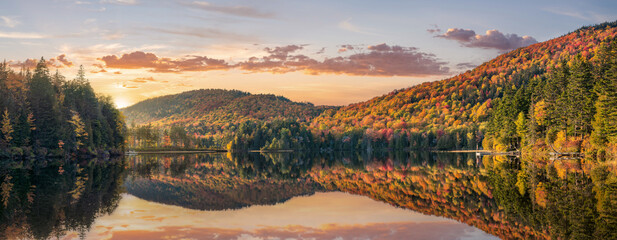 Maine  - New England golden fall foliage with sunset autumn colors 