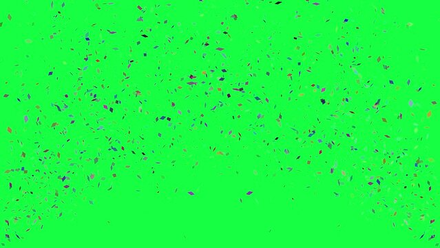 Multicolor confetti exploding on the side of the green screen, chroma key 