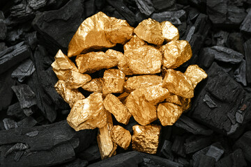Golden nuggets on black charcoal