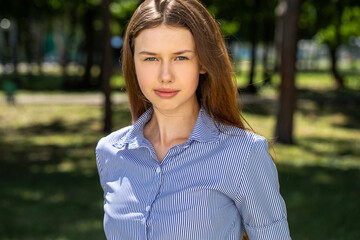 Portrait of a young tenager, summer park outdoors