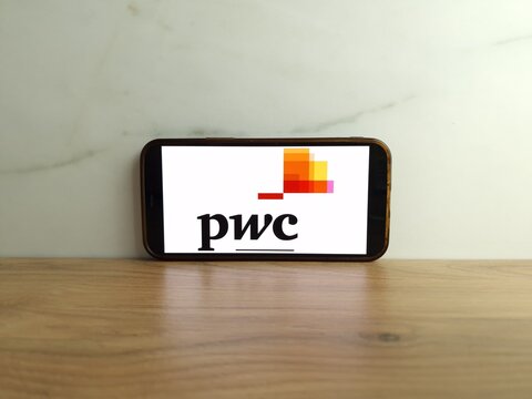 Konskie, Poland - June 17, 2023: PwC professional services brand logo displayed on mobile phone screen