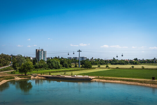 Pond in Mannheim city with ropeway connecting parks during federal horticulture and garden show (Bundesgartenschau BUGA), Germany