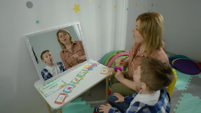 Empowering Communication: Captivating Video of a Young Boy Participating in Speech Therapy Sessions and Mastering Language Skills. High quality 4k footage
