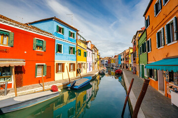 Fototapeta na wymiar The Burano island near Venice, a canal between colorful houses, Italy, Europe.