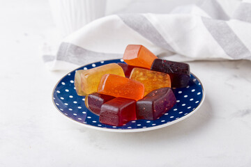 Sugar free, gluten free homemade jelly marmalade on the plate with fruits and berry