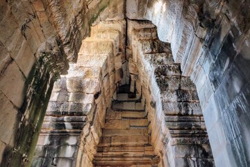Ancient stone vaulted ceiling and walls, Cambodian stone construction.