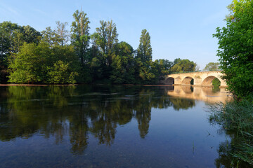 Fototapeta na wymiar Loiret river bank and Saint-Nicolas bridge in Saint-Hilaire-Saint-Mesmin village.