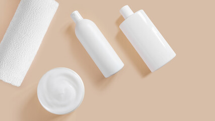Set of white cosmetic bottles and creams on a beige background.
